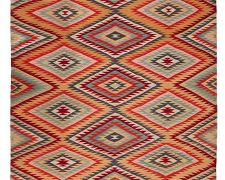 199
A Large Navajo Germantown Eyedazzler Rug
Late 19th century, Diné
Woven in dark red, cream, turquoise, blue, dark grey, and other colored wools, with stacked serrated diamond motifs
74" H x 89" W
Estimate: $4,000 - $6,000