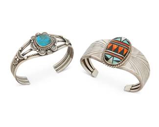 390
Two Southwest Silver And Stone Set Cuff Bracelets
Late 20th century
Two works:

An Ella M Linkin Navajo sterling silver cuff
Ella M Linkin (b. 20th century, Diné)
Stamped: E.M.Linkin / Sterling
A three-wire silver and turquoise cuff with deeply stamped applied motifs
6.75" inner C x 1.25" H, with a 1.25" gap

A Teresa Joe Navajo sterling silver and multi-stone inlay cuff
Teresa Joe (b. 20th century, Diné)
Stamped: TJO / Sterling
A three-wire cuff with mosaic inlay of onyx, spiney oyster, turquoise and mother-of-pearl with chased silver overlay plaques to each side
6.5" inner C x 1.625" H, with a 1.25" gap

2 pieces total
78.0 grams gross
Estimate: $400 - $600