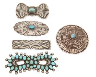 459
A Group Of Southwest Silver And Turquoise Jewelry
Mid/late 20th century
Two marked for artist; two marked for sterling
Five silver brooches, four with set turquoise, including a Mary Cayatineto (Diné) Navajo incised sterling silver butterfly/bow concho brooch, an LE sterling silver round concho style brooch, as well as an oval concho brooch, a large cluster-set turquoise bow brooch, and a repoussé silver bar brooch, 5 pieces
Largest: 1.625" H x 3.75" W; smallest: 0.75" H x 3" W
123.8 grams gross
Estimate: $300 - $500