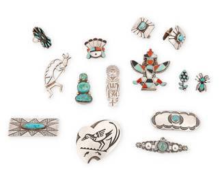 482
A Group Of Southwest Silver And Stone Jewelry
Mid/late 20th century
One marked HC [conjoined; for Hopi Crafts]; Two marked: Sterling
Comprising eleven brooches in various sizes, styles, and motifs including a large Hopi Crafts silver overlay bird brooch, a silver overlay katsina brooch/pendant, a Kokopelli brooch, a Zuni-style Knifewing brooch and a sunface brooch, each with set turquoise and coral inlay, as well as six set turquoise brooches, including a Fred Harvey style thunderbird brooch, and a pair of cuff links and a small petit point turquoise ring, 14 pieces
Largest: 2.125" H x 2" W; smallest: 0.75" H; ring size: 4
111.8 grams gross
Estimate: $300 - $500