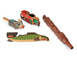 186
Four Northwest Coast Carved Wood Items
Four works:

Matthew Baker (b. 1966, Squamish/Kwakwaka'wakw)
A carved wood fish plaque, late 20th century
Signed and inscribed verso: Matthew Baker / Squamish Nation / Canada
With green, red, and black pigments
6.25" H x 16.375" W x 1" D

Russell Williams (b. 20th century, Coast Salish)
"Eagle Bowl," 1984
Carved and polychrome yellow cedar grease bowl
With penciled signature, titled, date, and inscription: Russell Williams / 09/1984 / Puyalop [sic] Tribe, Wa. U.S. A / Coast Salish / [cipher] / yellow cedar
4" H x 11.25" W x 3.25" D

A Northwest Coast carved wood fish club, late 20th century
Signed illegibly to underside
The totemic club depicting an eagle, bear, and other figures
23.75" L

A Northwest Coast carved wood rattle, late 20th century
Unmarked
The polychrome wood rattle carved in the figure of a wolf baring its teeth
3.5" H x 12" W x 3.625" D

4 pieces
Estimate: $300 - $500