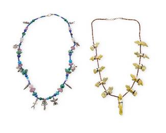 362
Two Southwest Multi-Stone Necklaces
Late 20th century
Charms variously marked for sterling
Comprising a carved green stone animal fetish necklace on a single strand heishi necklace (26.25" L), and a single strand multistone bead necklace including turquoise, lapis and amethyst, with a variety of Southwest motif silver charm spacers (26" L), 2 pieces
Bead necklace: 97.5 grams gross
Estimate: $200 - $400