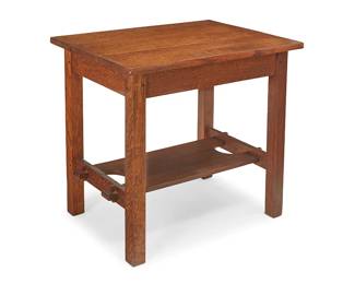103
A Roycroft Oak Side Table, No. 72
Circa 1910
Marked with Roycroft orb to apron
The quarter-sawn oak table with three-plank tabletop above a box apron and shaped undershelf with keyed mortise and tenon joints
28.25" H x 30" W x 22.5" D
Estimate: $1,000 - $1,500