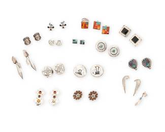 465
A Group Of Southwest-Style Silver And Set Stone Jewelry
Late 20th century
Nine stamped for sterling and six for artist: RH Boyd [for Randy Boyd, Navajo/Diné] / CP / E. Secatero / M / Mexico
Comprising thirteen pairs of earrings in various Southwest styles, sizes and designs, some with set stones including opal, turquoise, onyx, sugilite, coral and mother-of-pearl, as well as an ear cuff with feather dangle and a further pair of spiney oyster and turquoise inlay clip earrings together with a matching ring, 30 pieces
Largest: 3" H; smallest: 0.625" H; Ring size: 13 (adjustable)
202.8 grams gross
Estimate: $200 - $400
