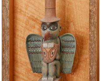 182
A Northwest Coast Haida Totem
Late 20th century; Pacific Northwest Coast
Unsigned
The polychrome carved wood eagle figure mounted in a wood shadowbox frame
Figure: 15" H x 6.625" W x 4.375" D
Estimate: $100 - $200