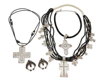 468
A Group Of Southwest-Style Sterling Silver And Jet Jewelry
Late 20th century
Each marked for sterling; two further marked: D. Lucas
Comprising a Don Lucas multi-strand jet bead necklace accented with stamped silver crosses and a large cross pendant, with a traditional wrapped neck cord (26" L x 3" H), and a Don Lucas large silver cross pendant suspended from a black leather cord (36" L x 3" H), together with a black velvet cord necklace with a large stamped silver cross pendant (16" L x 3.5" H), and a pair of onyx set silver naja-style pierced earrings (each: 1.75" H), 5 pieces
231.0 grams gross
Estimate: $800 - $1,200
