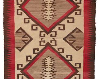 211
A Navajo Regional Rug
Early 20th century, Diné
Woven in red, cream, dark brown, and grey wool, depicting two central diamonds with hooked borders encapsulating stacked triangle motifs, bird motifs at corners, and sawtooth border to selvage edges
40.5" H x 67" W
Estimate: $200 - $400