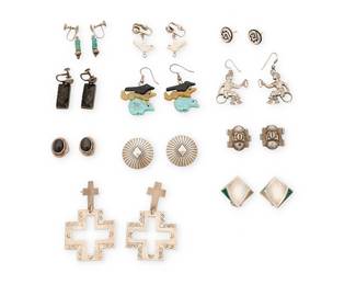 464
A Group Of Southwest-Style Silver And Stone Earrings
Mid/late 20th century
Comprising eleven pairs of silver and set stone earrings, by various makers in various styles and motifs including one pair in Hopi overlay by Ramon Dalangyawma, as well as conchos, carved stone bird fetish dangles, Hopi ring dancer motifs, crosses, and three pairs of Mexican style earrings with set stones including carved obsidian, 22 pieces
Largest: 2.5" H; smallest: 0.5" Dia.
86.5 grams gross
Estimate: $200 - $400