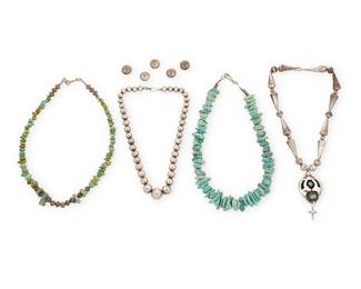 366
A Group Of Southwest Silver And Turquoise Necklaces
Mid/late 20th century
Pendant stamped: J*C
Comprising a graduated stamped silver bead necklace (17.25" L), a silver bead necklace with alternating cone and round beads with a set turquoise shadowbox pendant (17" L x 3" H), a small turquoise nugget necklace with silver bead spacers (19.5" L), and a chunky graduated turquoise nugget necklace (19" L), as well as a group of five Liberty coin beads (each: 0.625" Dia.), 9 pieces
232.8 grams gross
Estimate: $500 - $700