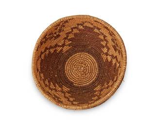 134
A Maidu Basketry Bowl
Early 20th century; Northern California
The basketry bowl with central stepped floral motif with elaborate border
3.75" H x 8.125" Dia.
Estimate: $500 - $700