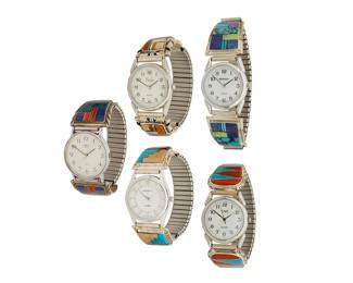 448
A Group Of Southwest Stone Inlay Wristwatches
Mid/late 20th century
Each variously stamped: Sterling / W / H. Francisco / 1/20 / 12K / G.F.
Five multicolored stone inlay and silver and gold filled watch bands in various stones including turquoise, coral, onyx, malachite, lapis lazuli, and tiger's eye, each band plate with motifs to edges, and each fitted with quartz watches, 5 pieces
Each plate: largest: 1" H x 1.875" W; smallest: 1" H x 1.625" W
235.9 grams gross
Estimate: $200 - $400