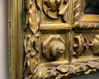 Carved gilt mirror    44"h x 54"w 