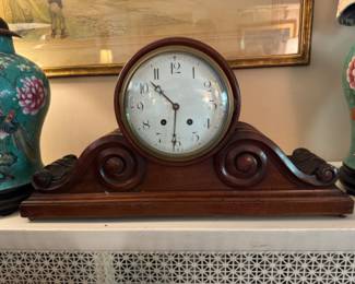 Carved mahogany tambour clock                                              27" long x 14.5"h x 7.5"d