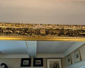 Carved gilt mirror    44"h x 54"w 