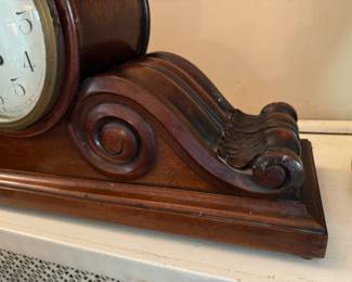 Carved mahogany tambour clock                                              27" long x 14.5"h x 7.5"d