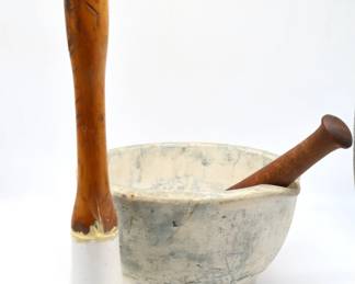 Antique pestle with wooden handle and porcelain 