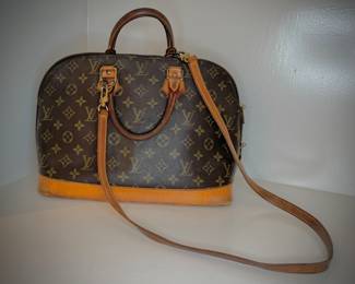 Louis Vuitton Alma PM handbag, cut to leather at back bottom corner