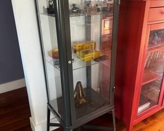 Metal cabinet with glass doors.