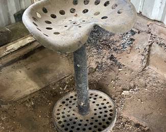 Stool made from an old tractor seat