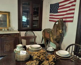 Vintage Pottery Barn china with gold rim, gold plate flatware, antique glasses, gold grape clusters.