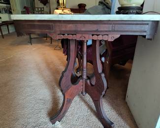 Antique side table with marble top.