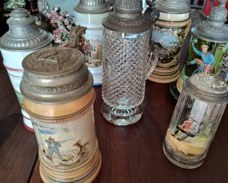 Early 1900s antique hand painted beer steins.