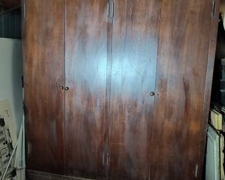 70 Wide x 81 Tall  Mahogany double free-standing closet.