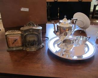 Antique gold clock with light-up fireplace.  Antique 4pc silver plated tea service.