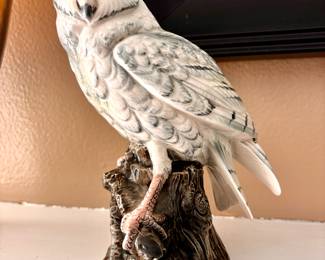 Snow owl on stand