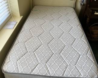 This picture shows a twin bed headboard, footboard, and mattress set.  If you look in the upper right corner, there is a Raggedy-Ann doll.  There is a better picture later.