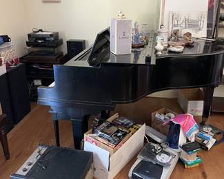 Did you think we didn't have a piano?  There is a small grand piano here.  Look down to the left to find a vintage LP player.  In the far corner, more audio & video components.  On top of the table is a Lladro box, which means there is a Lladro figurine.  You'll need to ask to see it, though.