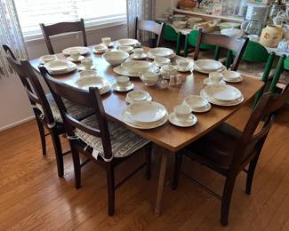 This is the larger dining room table, six matching chairs, and of course the vintage china.  Look carefully in the background at the four matching green chairs