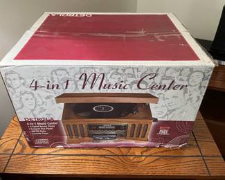 This is a nice audio music center: record turntable, CD player, AM/FM stereo, and cassette player.  Admit it, you have some cassettes you want to play, don't you?