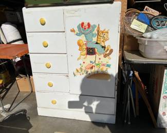 This vintage children's dresser features Bozo the Clown on the armoire door.  This piece needs a bit of cleaning and care, but it quite interesting.