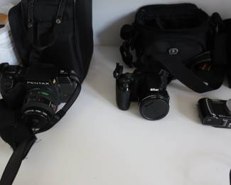 three cameras Pentax SF10 Nikon L820 Panasonic DMC-T25 Lumix