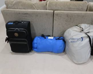 luggage, sleeping bag and blow up mattress