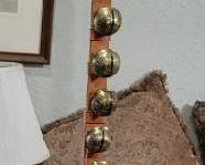 Brass bells on leather strap