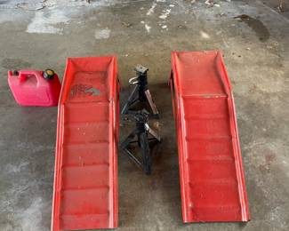 Car Ramps and jack stands.  Look up the price new before stopping by.