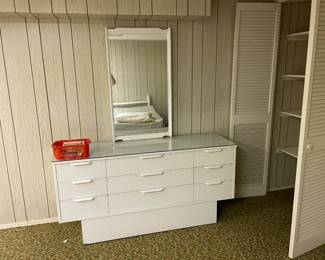 Large dresser with mirror. 2-twin headboards (see reflection in the mirror).