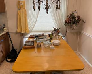 A distant view of kitchen table.. Hanging basket also for sale.