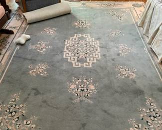 Close up of area rug and multi[-tier candle set/stand