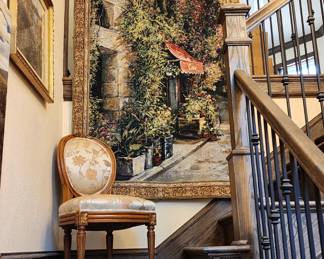 we have art and a tapestry on the staircase.