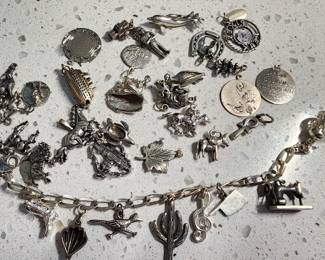 Sterling Charm bracelet with many charms