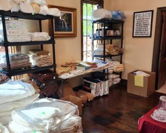 a room full of linens, most are brand new