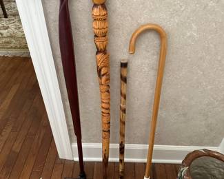 Walking sticks, one carved, one signed