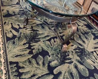 Heavy glass top wrought iron coffee table, also have two matching occasional tables