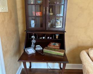 Small mahogany bookcase secretary with Cabrio legs circa 1990