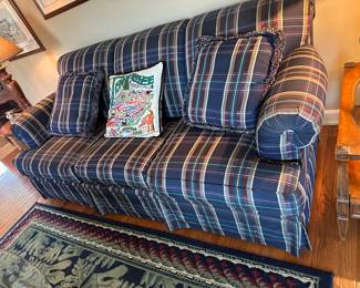 Navy blue, green, red plaid sofa
