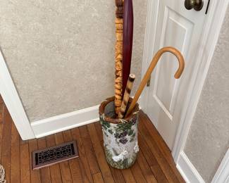 Umbrella stand with collection of canes