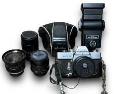 Minolta SRT101 35mm Film Camera w/ A Minolta MC 50mm f/1.7 Rokkor-PF Standard Prime Lens, A Vivitar Wide-Angle 21mm f/3.8 Lens, A Vivitar Auto Telephoto 135mm f/2.8 Lens, A Vivitar Auto Wide-Angle 28mm f/2 Lens, And A Vivitar Zoom Thyristor Flash Model: 285